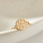 Gold Hecate's Wheel Ring on Cream Background