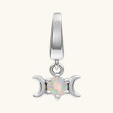 A silver triple moon charm pendant featuring a central round iridescent opal gemstone, set against a plain off-white background.