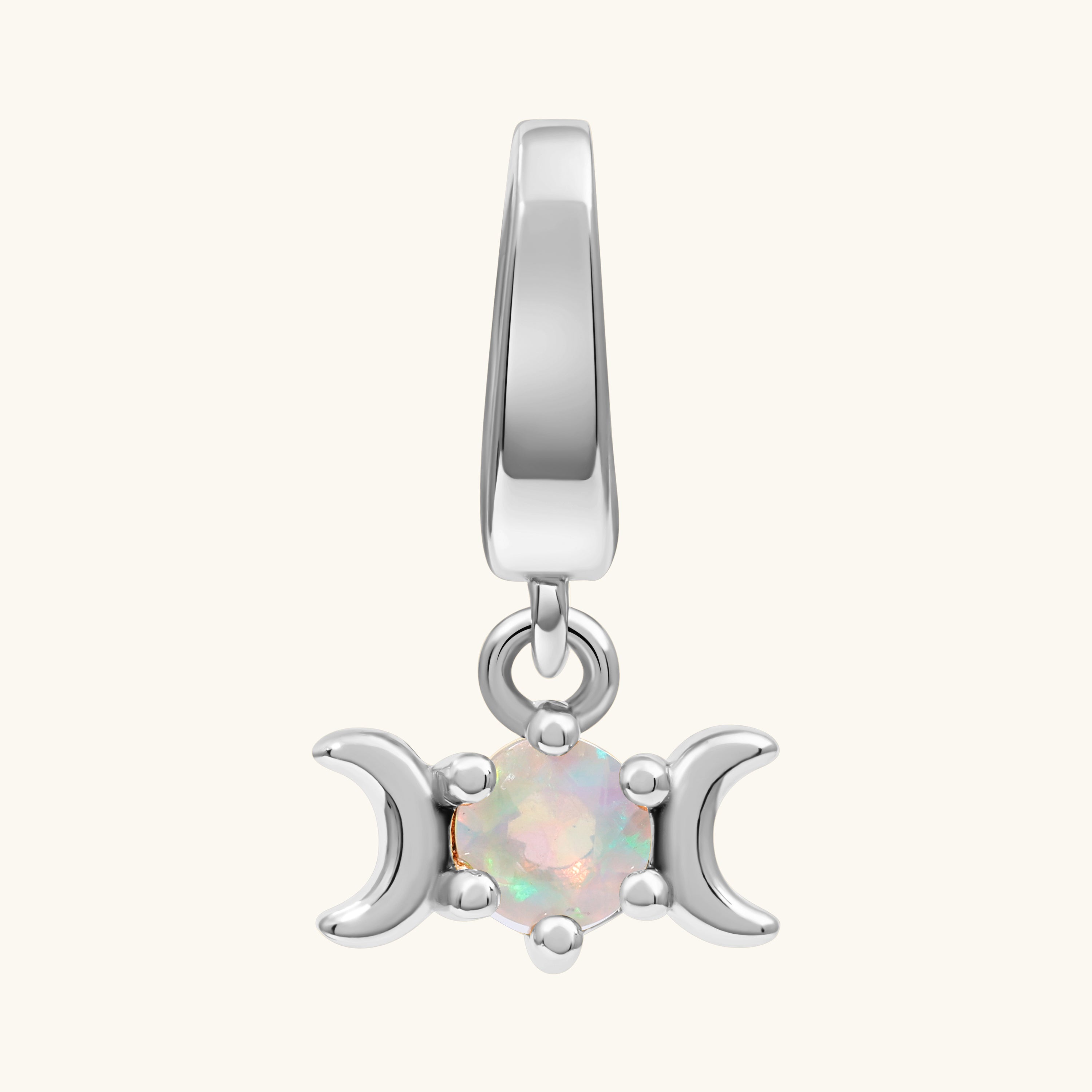A silver triple moon charm pendant featuring a central round iridescent opal gemstone, set against a plain off-white background.