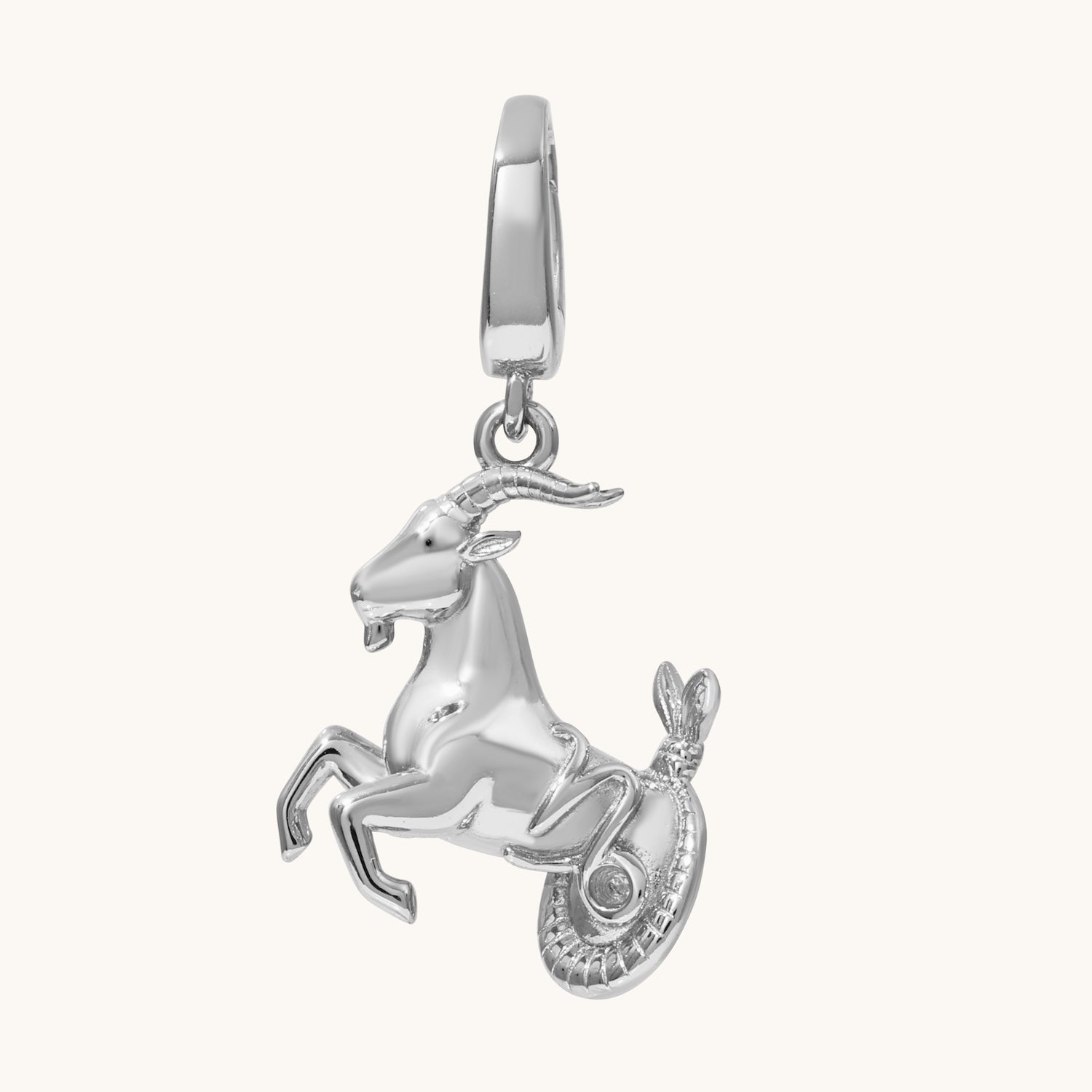 Silver goat pendant charm on a white background