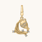 Gold pendant with white topaz stone accents on a white background