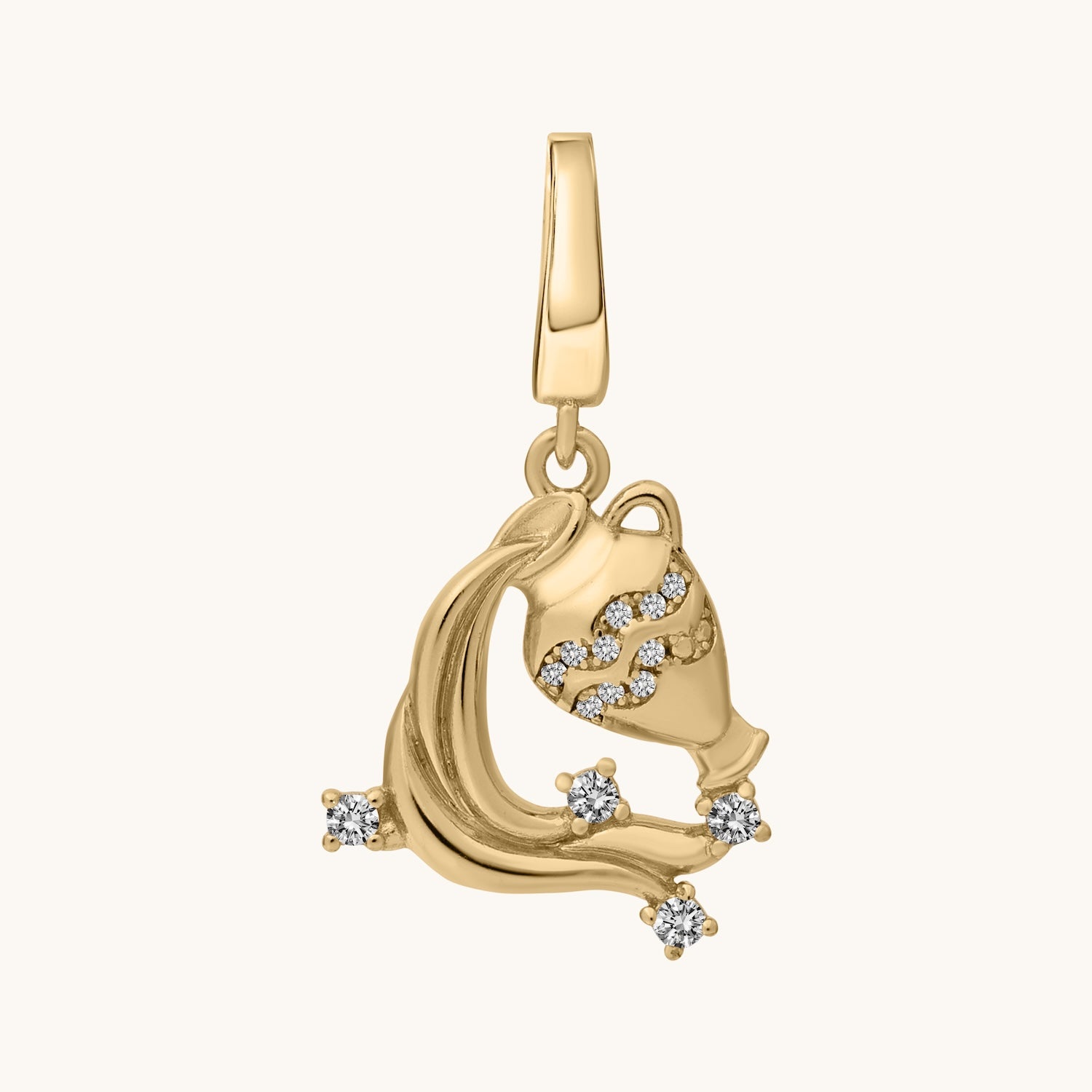Gold pendant with white topaz stone accents on a white background