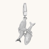 Silver Pisces zodiac charm on a white background
