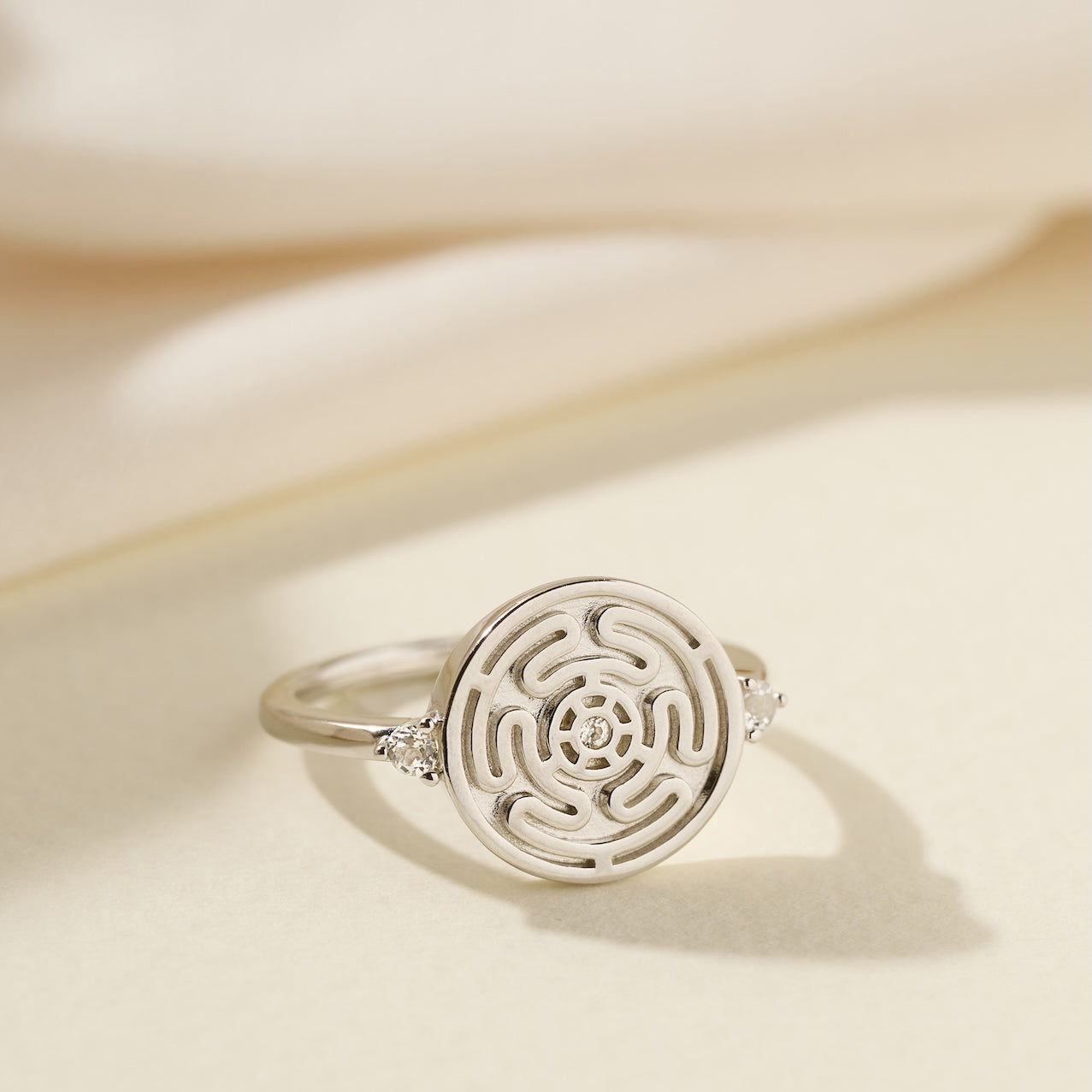 Silver Hecate's Wheel Ring on Cream Background