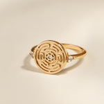 Gold Hecate's Wheel Ring on Cream Background