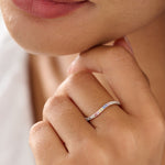Close-up of a hand wearing a ring with a blurred background