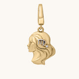 Gold pendant with a face design and 'Libra' zodiac symbol on a white background