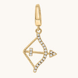 Gold pendant with white topaz stone accents on a white background