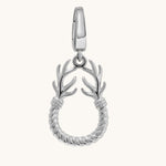 A silver charm featuring a twisted rope circular body with two antler-like branches extending upward from the top, shown on a plain off-white background.