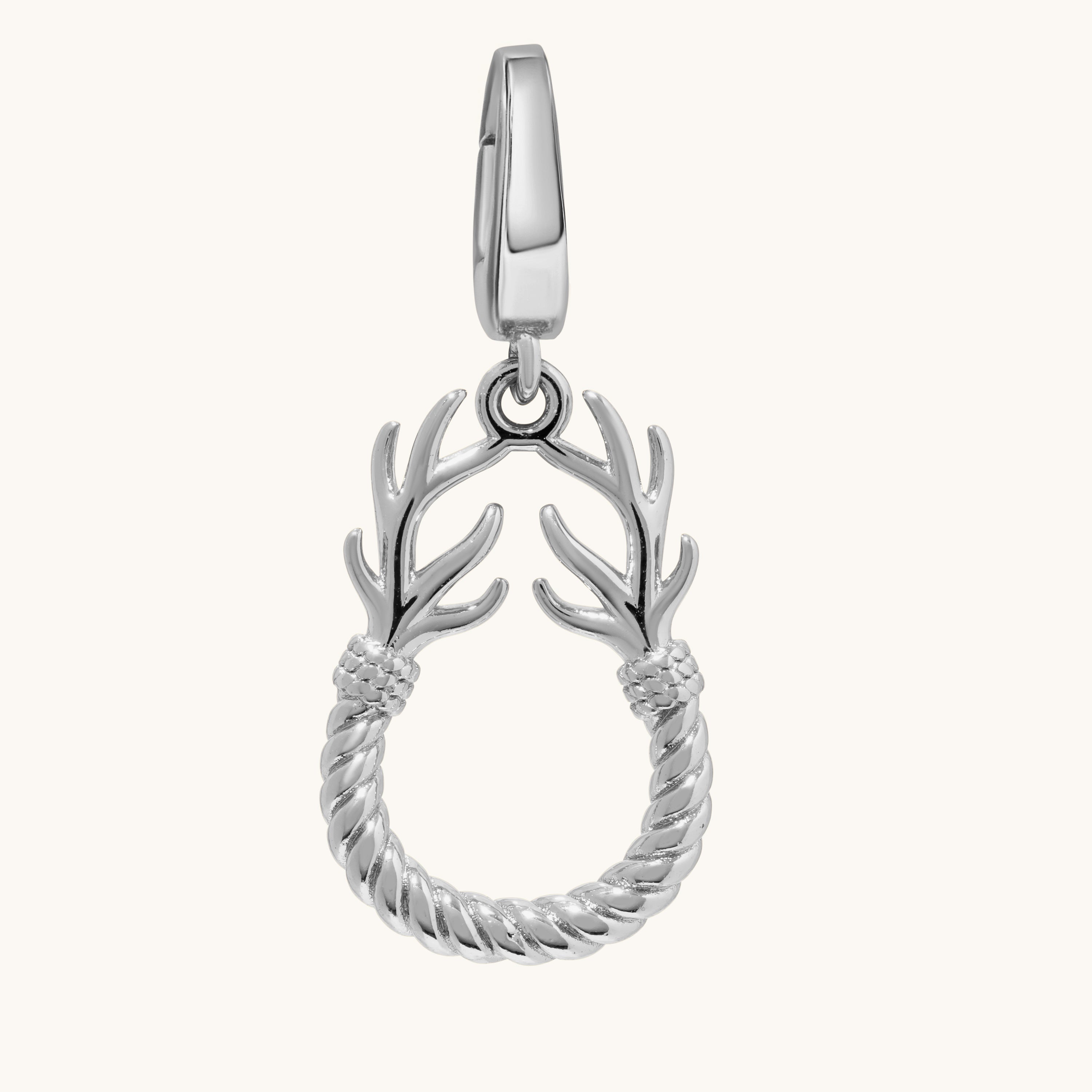 A silver charm featuring a twisted rope circular body with two antler-like branches extending upward from the top, shown on a plain off-white background.
