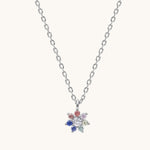 Necklace with a colorful flower-shaped pendant on a white background
