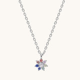 Necklace with a colorful flower-shaped pendant on a white background