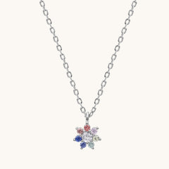 Necklace with a colorful flower-shaped pendant on a white background