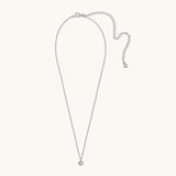 Silver necklace with a small pendant on a light gray background