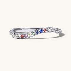 Silver ring with colorful gemstones on a white background